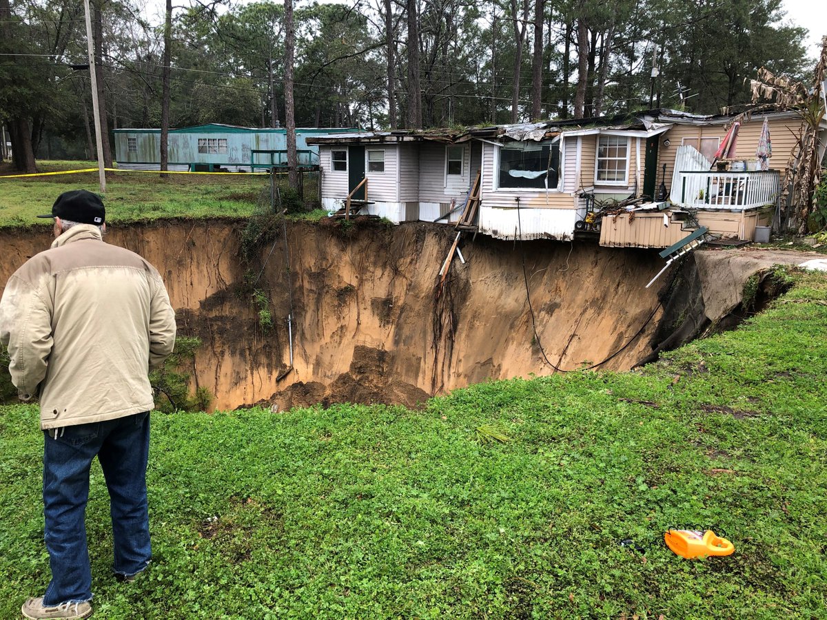 massive sinkhole that's threatening to take out at least one Tallahassee home in Capital Circle Pines mobile home park near Capital Circle SW and Crawfordville Highway.