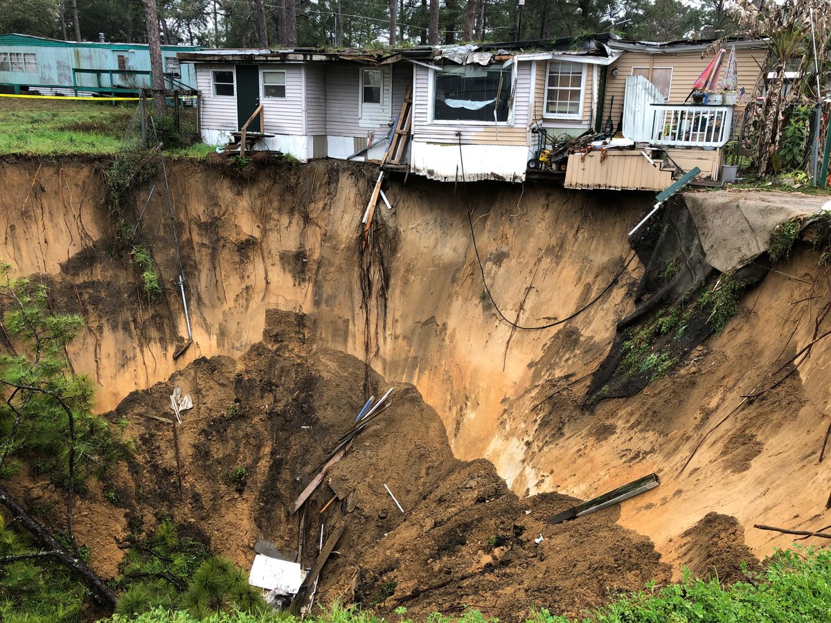 massive sinkhole that's threatening to take out at least one Tallahassee home in Capital Circle Pines mobile home park near Capital Circle SW and Crawfordville Highway.