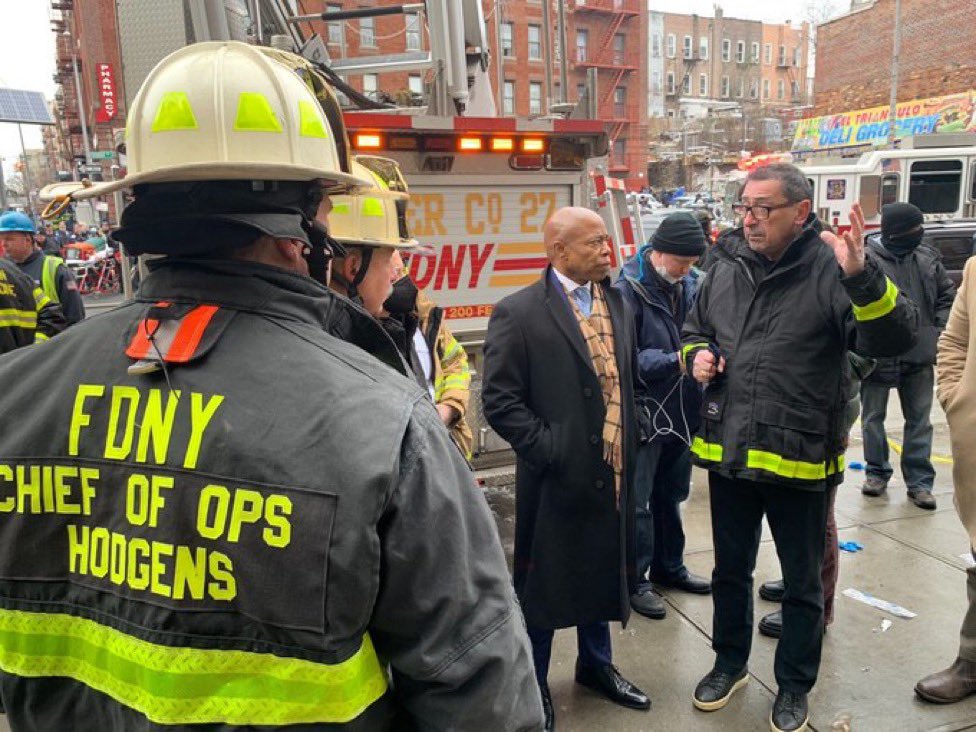 PHOTO: NYC Mayor Eric Adam's is briefed by FDNY Commissioner Daniel Nigro at the scene of the 5-alarm fire at 333 East 181 Street in the Bronx. At least 31 people seriously injured. Red Cross on scene