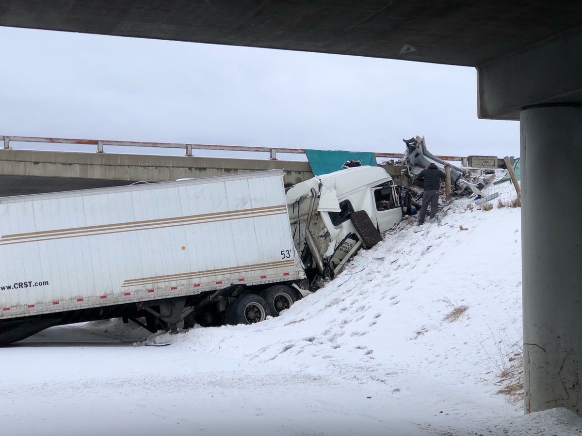 A semi slid off I-90 and is underneath the bridge at Fort Ellis Road, the overpass is blocked