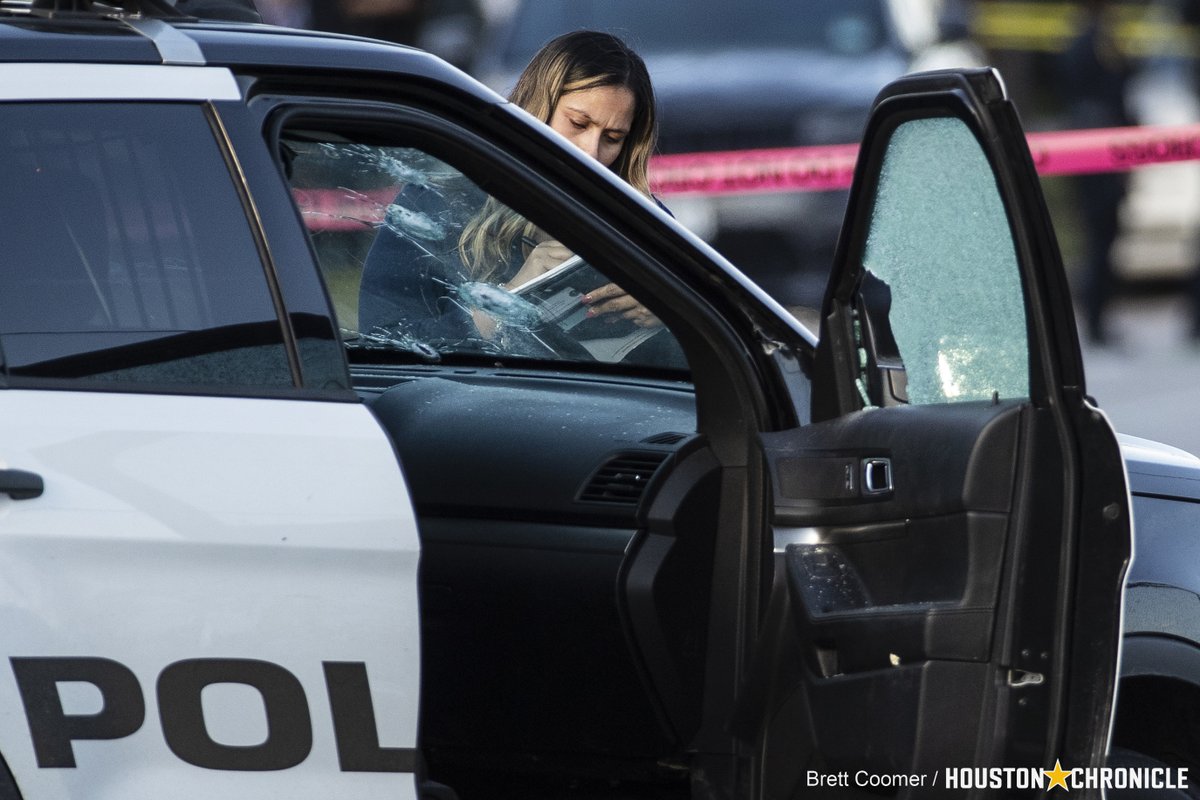 Houston police investigate the scene where 3 Houston police officers were shot after responding to a call for a disturbance. HPD Chief Troy Finner said the suspect fired at the officers with what appeared to be an automatic weapon houstonchronicle