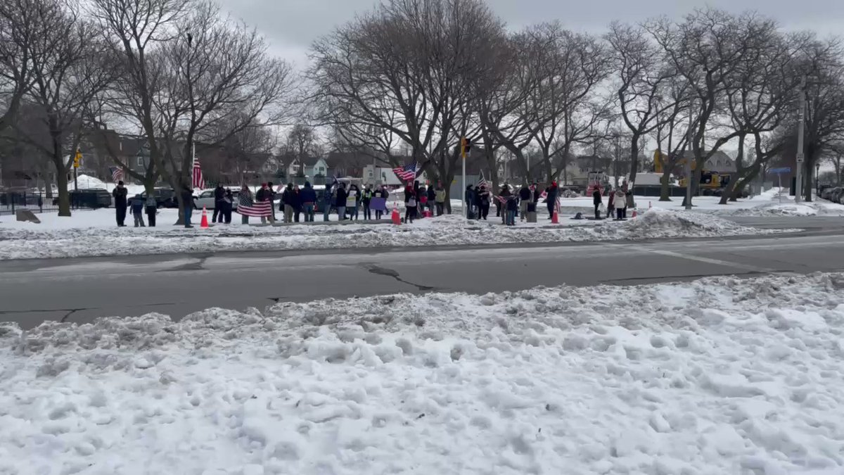 Small group of protesters awaiting an expected slow roll protest at the base of the Peace Bridge in Buffalo