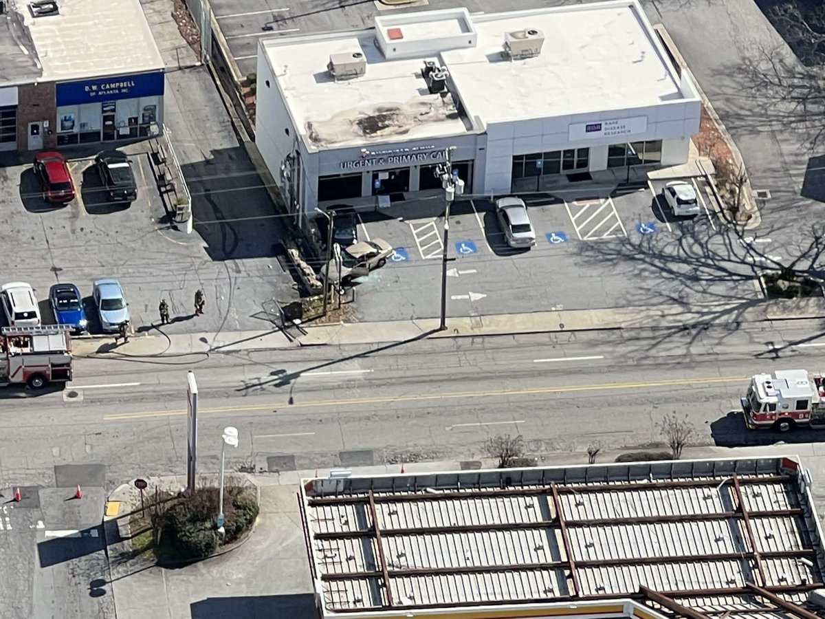 All lanes blocked on Howell Mill Tf while @Atlanta_Police and @ATLFireRescue investigate what caused a car to drive into the Buckhead Primary Care Clinic on Howell Mill Rd near I-75. atltraffic developing