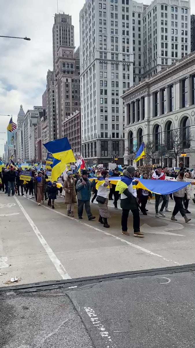 Thousands of people marching on Michigan Avenue, yelling close the sky over Ukraine