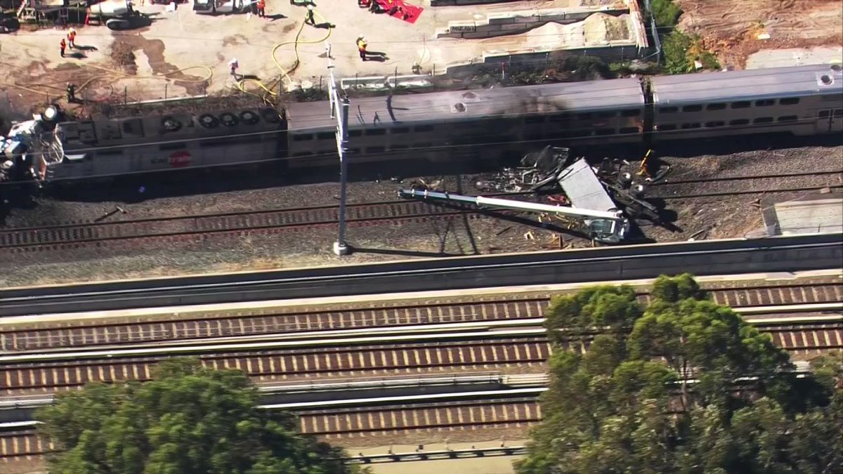 Caltrain service stopped in San Bruno after train strikes vehicle. At least two people transported to the hospital, transit agency says