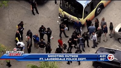 Scene when someone was taken into custody by police following the deadly shooting  on a Broward transit bus