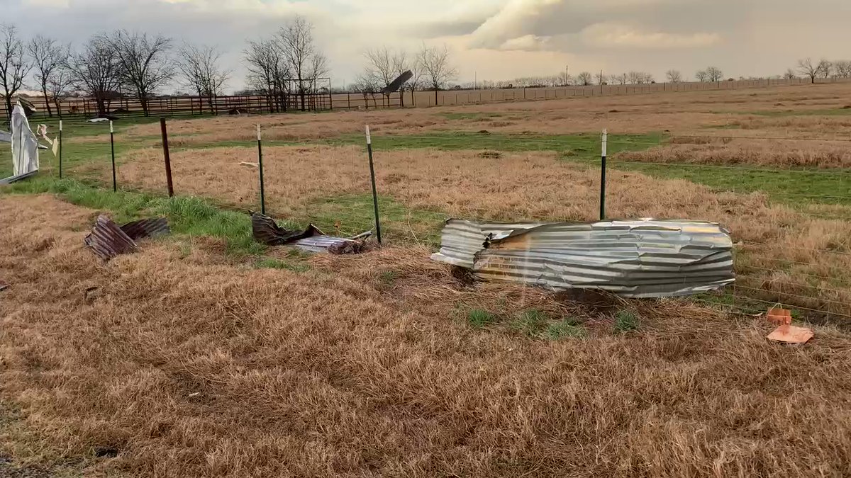 Debris field from damaged house and structure near Jerrell