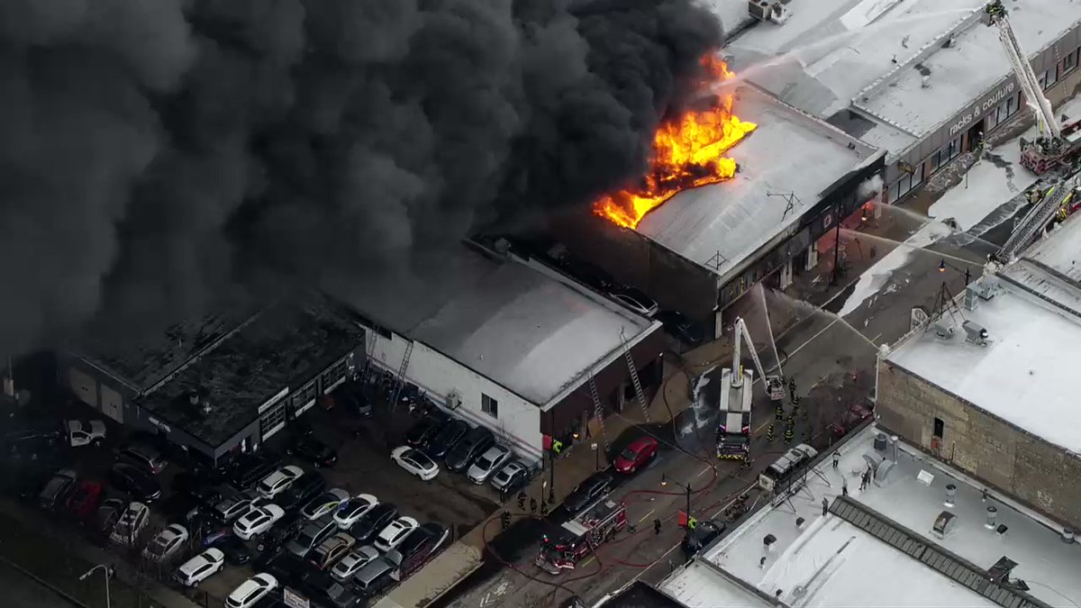 Footage of the roof collapsing at 3040 W Lawrence Ave. No injuries reported. Fire is now under control