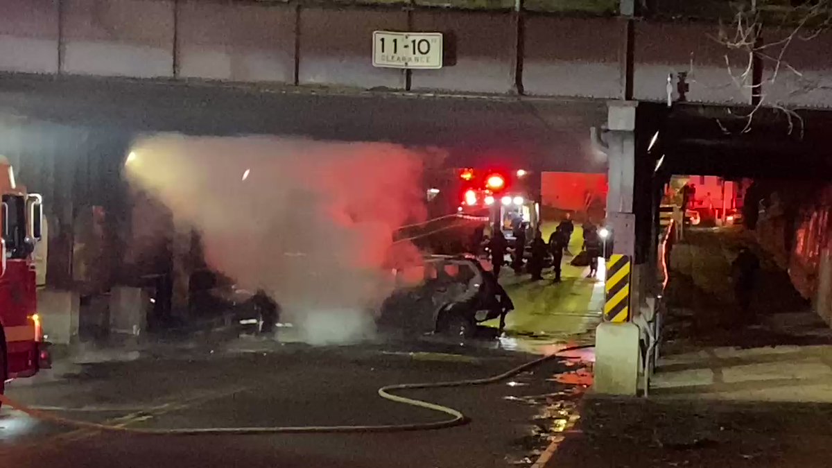 Rochester Police, Rochester Fire and AMR all on scene of a vehicle into the bridge on Maple st. and Saxton St.  car was on fire. Reports of a officer pulling 2 victims away from the fire. Firefighters working on the victims in the road