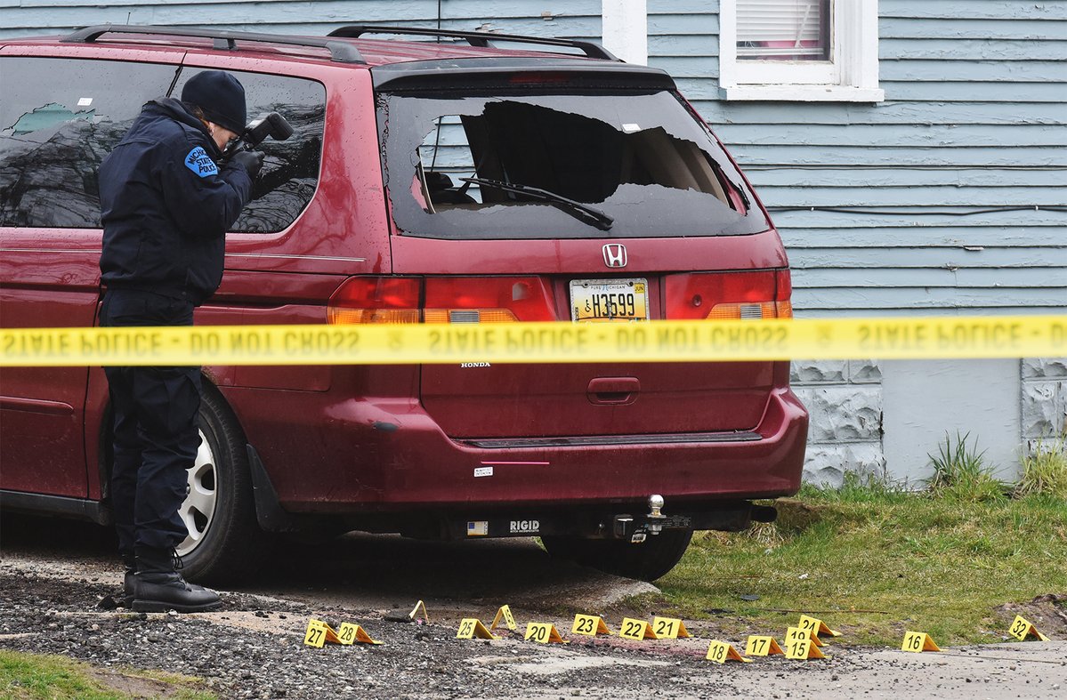 Michigan State Police continue to investigate the scene of a shooting in the 700 block of Highland Avenue in Benton Harbor Friday afternoon. A suspect was shot and killed and two Benton Harbor Department of Public Safety officers wounded during a shootout Thursday night
