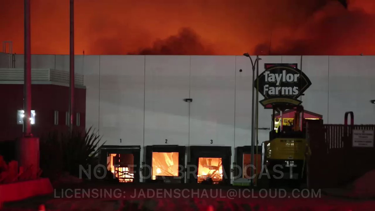 Raging fourth-alarm commercial structure fire at TaylorFarms facility on Abbott Street in Salinas, CA late Wednesday night. Firefighters have moved away from the building. Salinas PD officer tells ammonia may be involved.