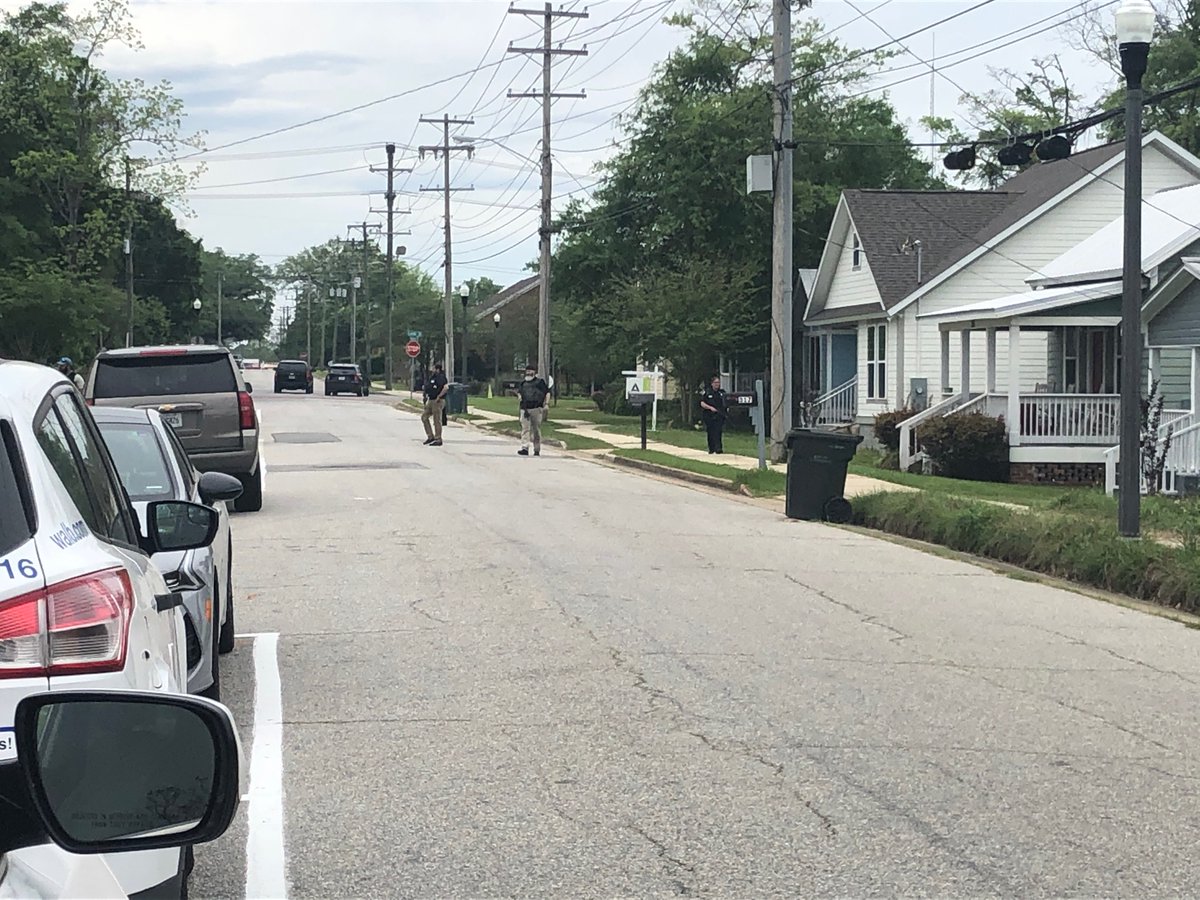 Plain clothes officers armed with rifles are searching this Thomasville neighborhood on the corner of Wright Street and Armster Lane for a man who shot at police earlier this morning