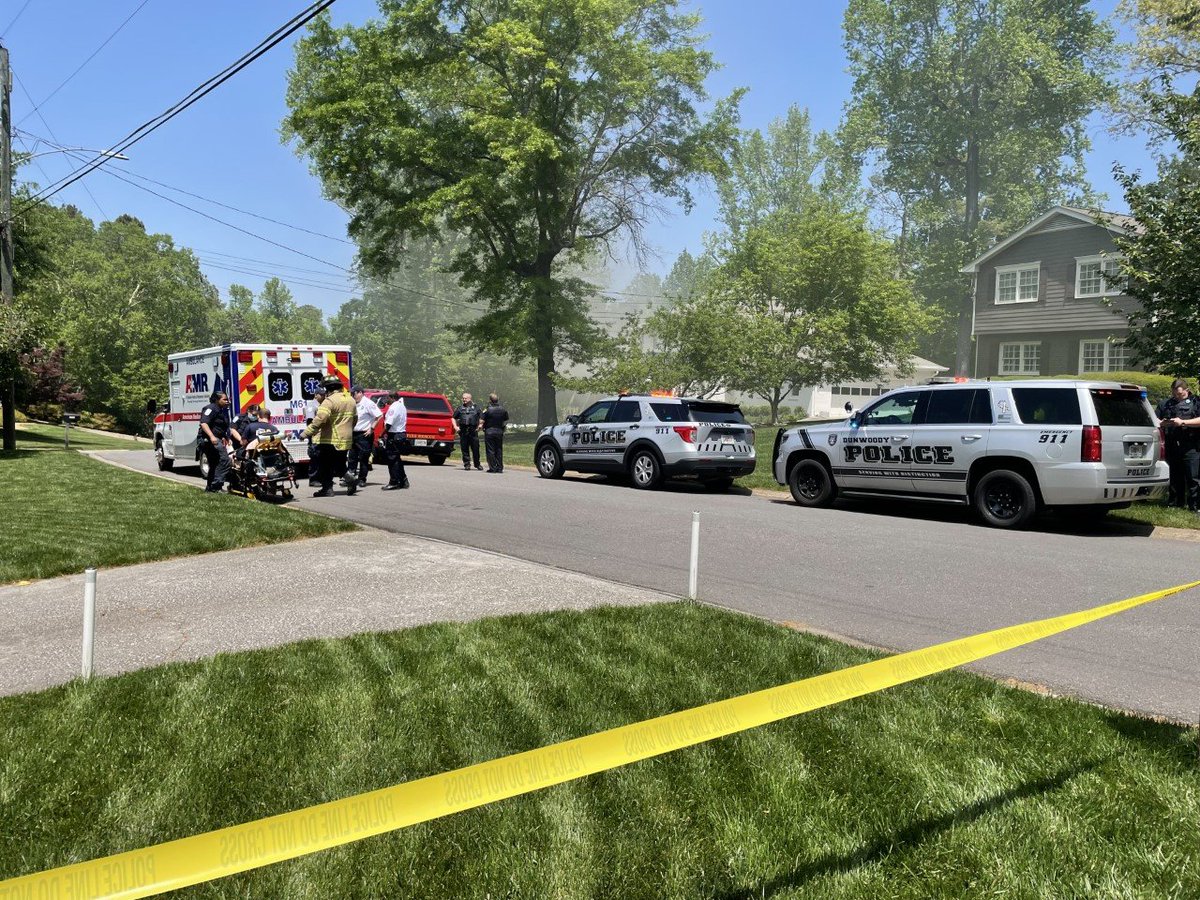 Crews are battling a house fire on Village Court in Dunwoody following an explosion, police say.