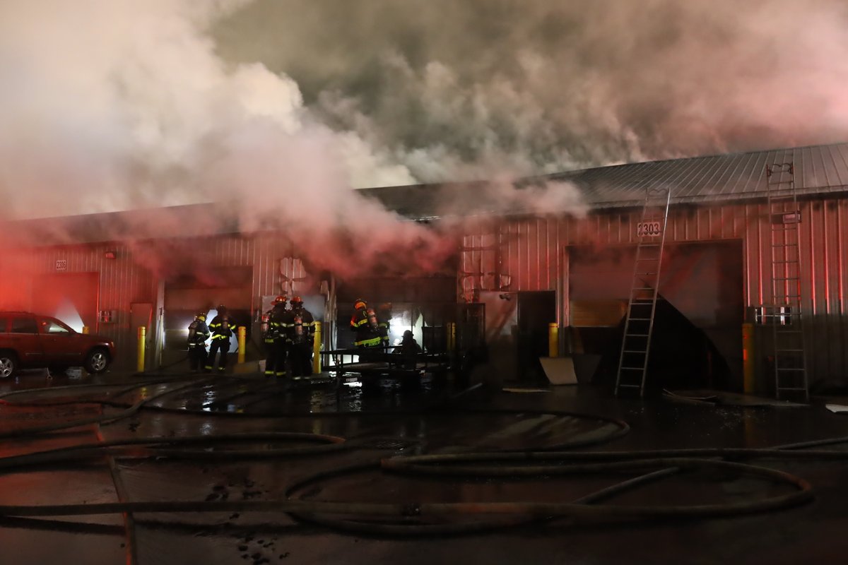 11:10 PM IFD FF's assisted by @Lawrence_FD arrived at 8126 Castleton to find a 9600 square foot building with  heavy smoke pushing from all 4 sides.  Despite efforts to initiate an aggressive offensive attack command ordered defensive attack only.