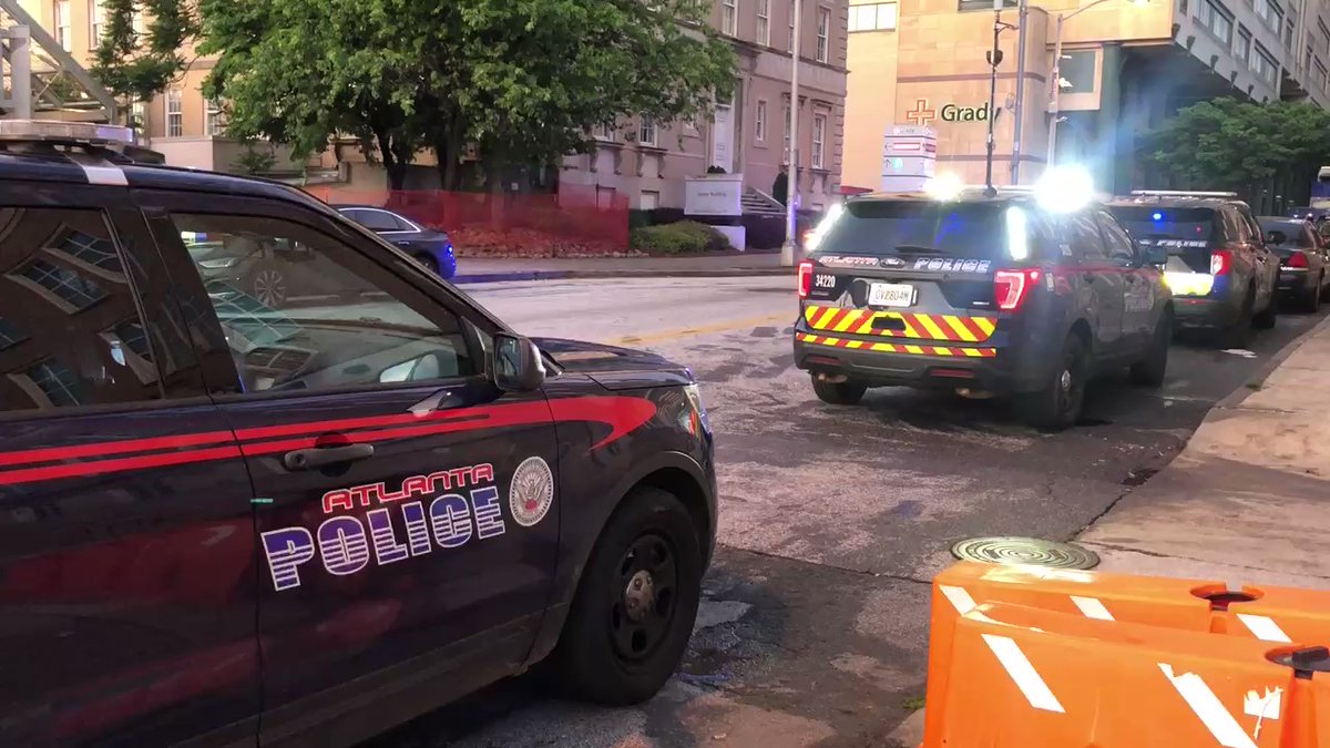 APD officer grazed by bullet, rushed to Grady Memorial Hospital