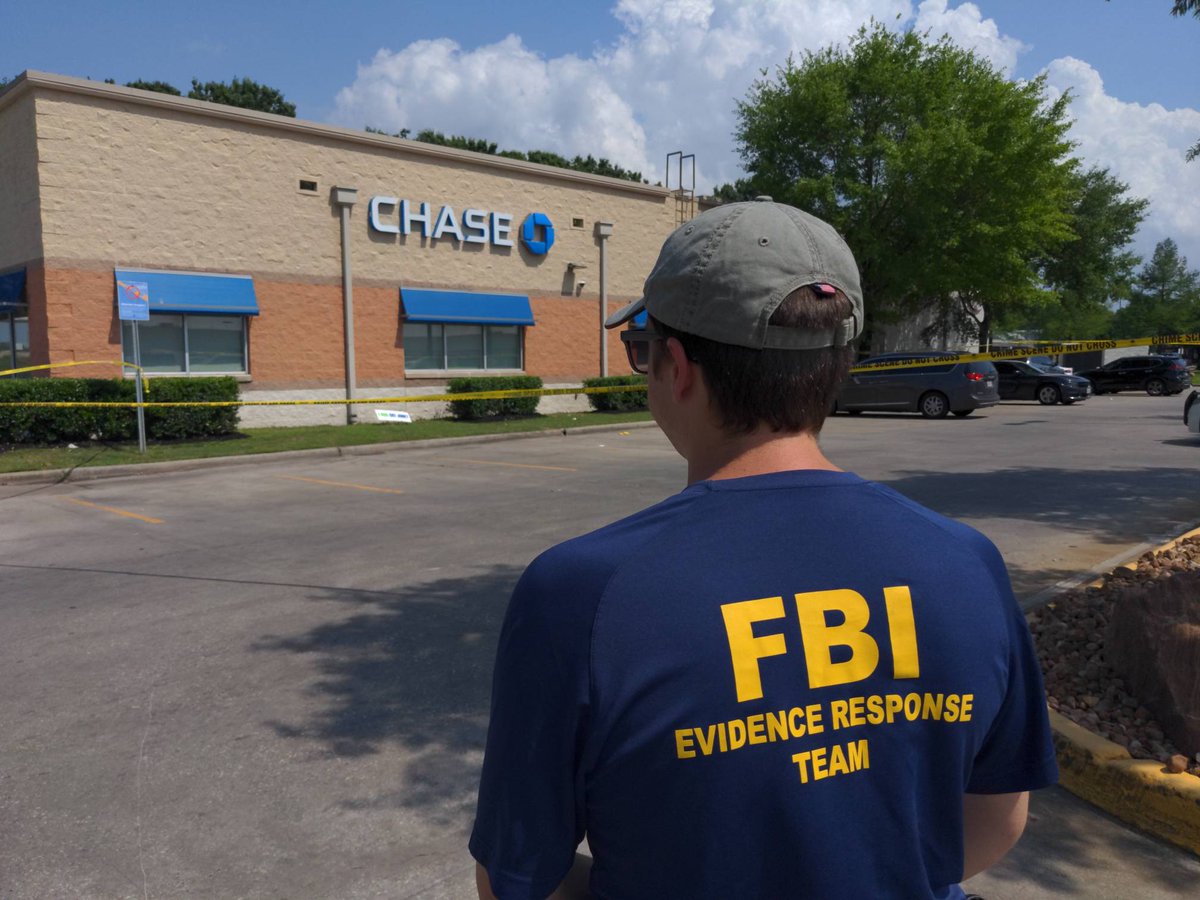 FBI Violent Crime Task Force and Evidence Response Team are processing the scene of a shootout that happened while an armored car guard was servicing an ATM at the Chase Bank off of West Rd and I-45N. An armored car guard was shot and at least one suspect was wounded