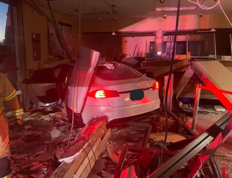 Kaysville Police tell this Tesla crashed into the bank after the driver failed to negotiate a turn.