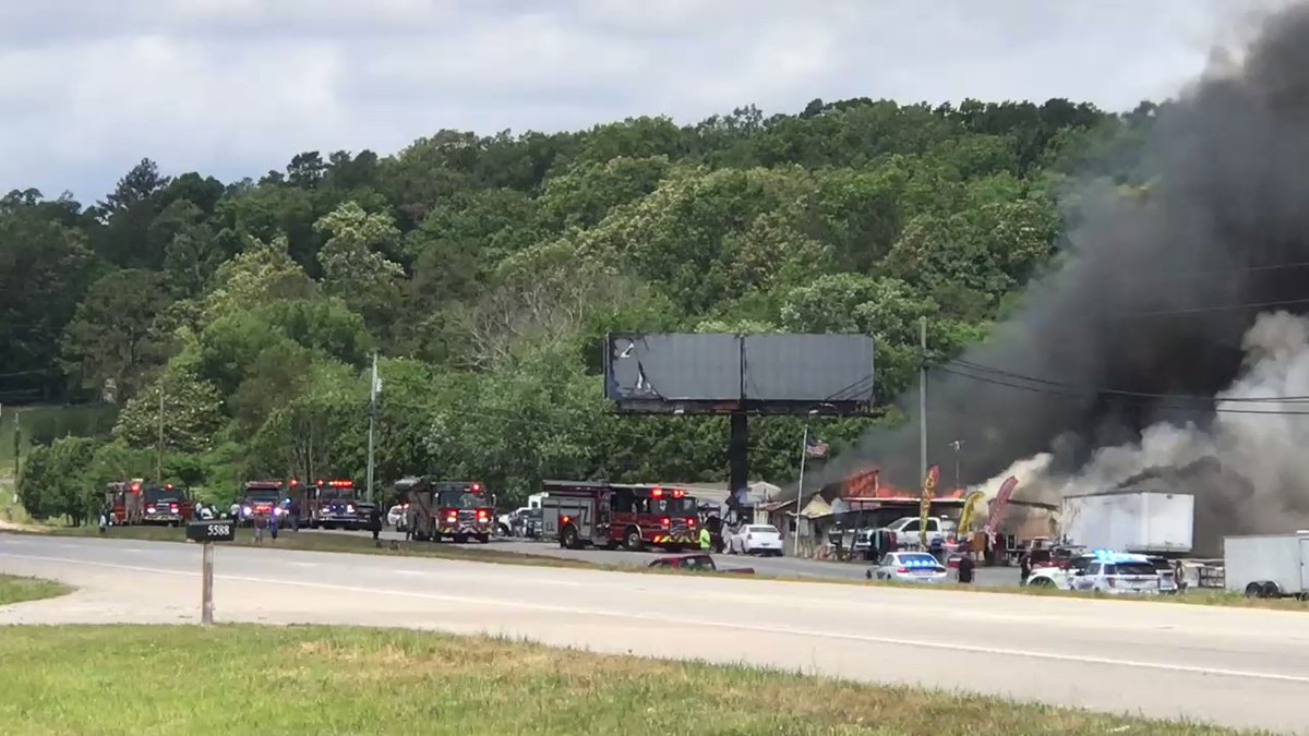 Emergency responders on scene. Police have blocked traffic in both directions here on HWY 64,   closer to Benton, TN. Concern has to be will fire spread to neighboring homes, etc. We just happened to be driving by. Never seen fire of this scale