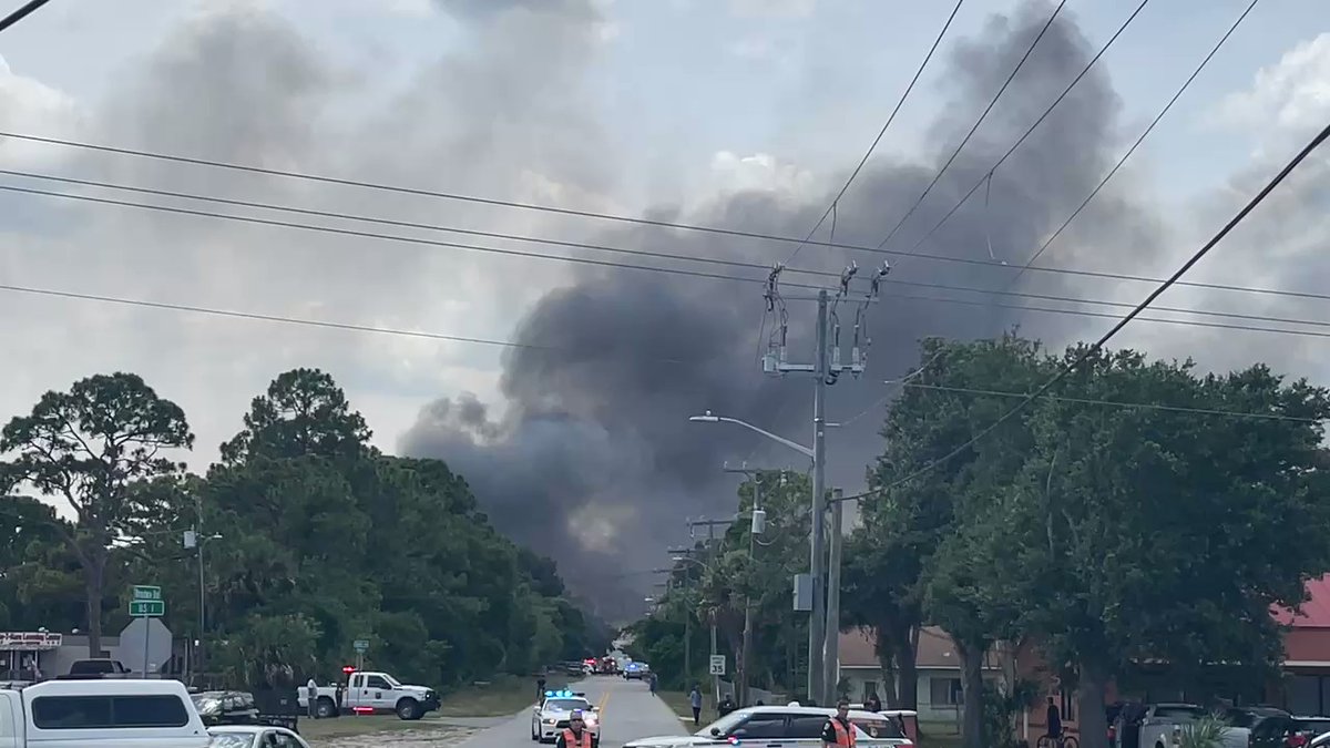 More thick, black smoke pouring into the sky.