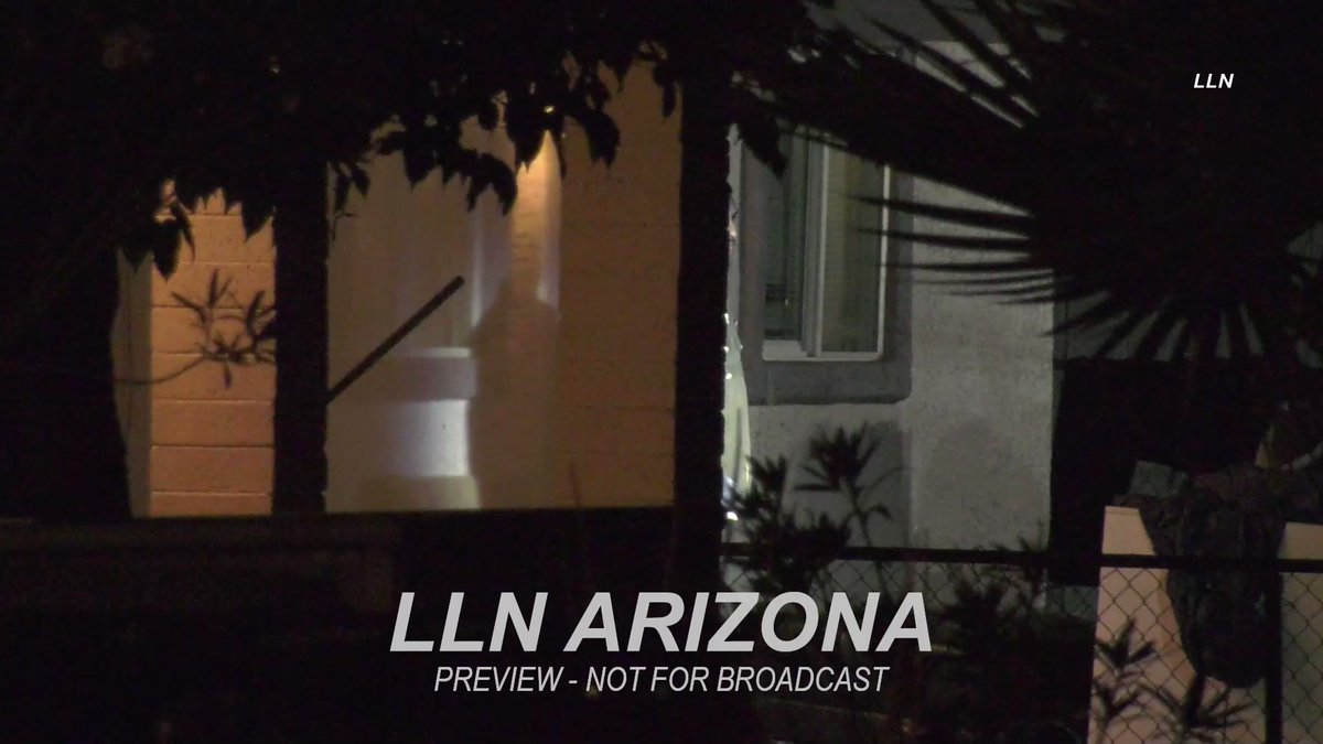 Moments Phoenix PD SWAT beanbags and tackles a barricaded man wanted for assault on an officer after he exits his house and begins yelling at officers