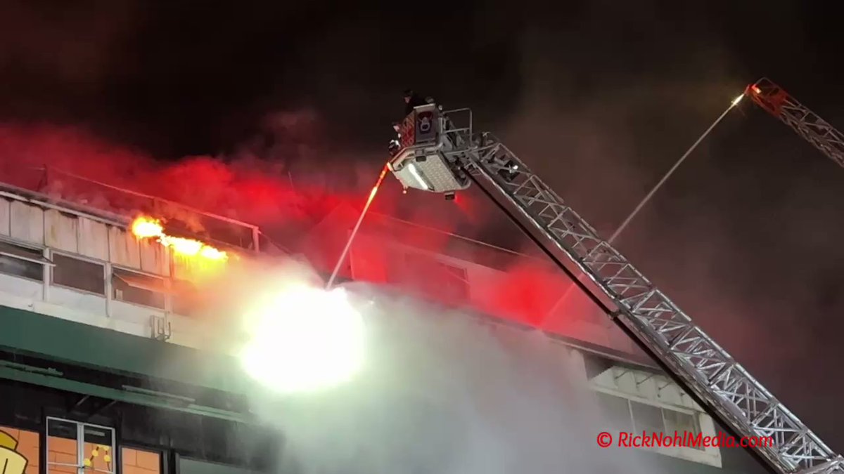 Boston 6th Alarm at the old Suffolk Downs race track. 2 Ladder Pipes and Tower 10 operating. Still have hvy smoke and fire in an old press box area.