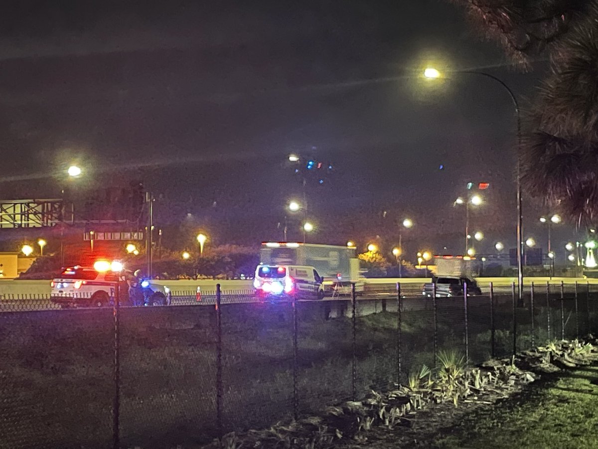 police on I-4 WB near Conroy, investigating apparent shooting. A pickup truck on the side of the road has several evidence markers around it WESH