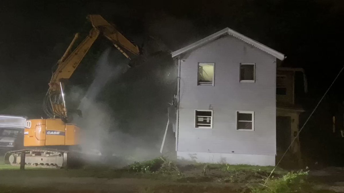 House on Lincoln Street being torn down after early morning fire.