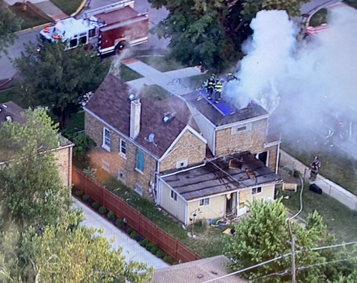 Broadview NorthRiverside Brookfield working on a house fire at 19th Ave & 13th St. Flames coming up through the roof now