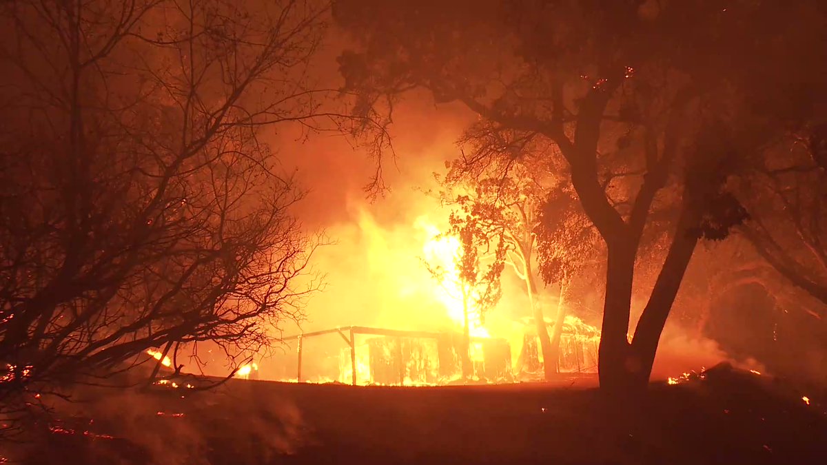 (Midpines, Mariposa Co) A home in the path of the OakFire explodes in a  fireball. The fire has now consumed over 4,000 acres and is threatening 1300 homes. 0% Contained