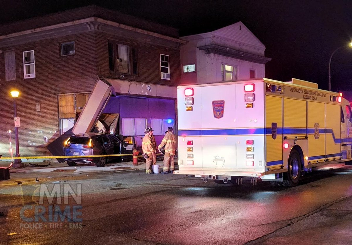 Firefighters reported they had the only occupant extricated from the vehicle and the person was not visibly injured. - A Structural Collapse Rescue Team is also on scene to assess the damage to the buildings