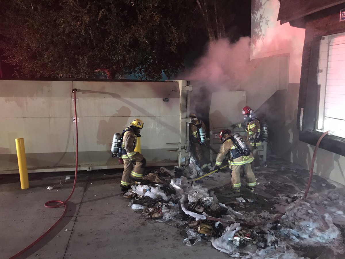 Structure Fire: 7055 Market Pl. Dr./Goleta. Trash Compactor Fire 10'x10'x20' Behind Ross Dept. Store/Workers arrived this morning, called 911.  Heavy smoke damage to stock room with light smoke thought store building. Fire Controlled/50min. Mop-up phase/under investigation.