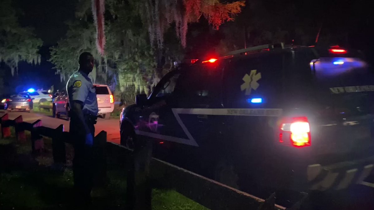 New Orleans Police officers are taping off the crime scene. One suspect is dead after shooting at deputies. The other suspect is still at large