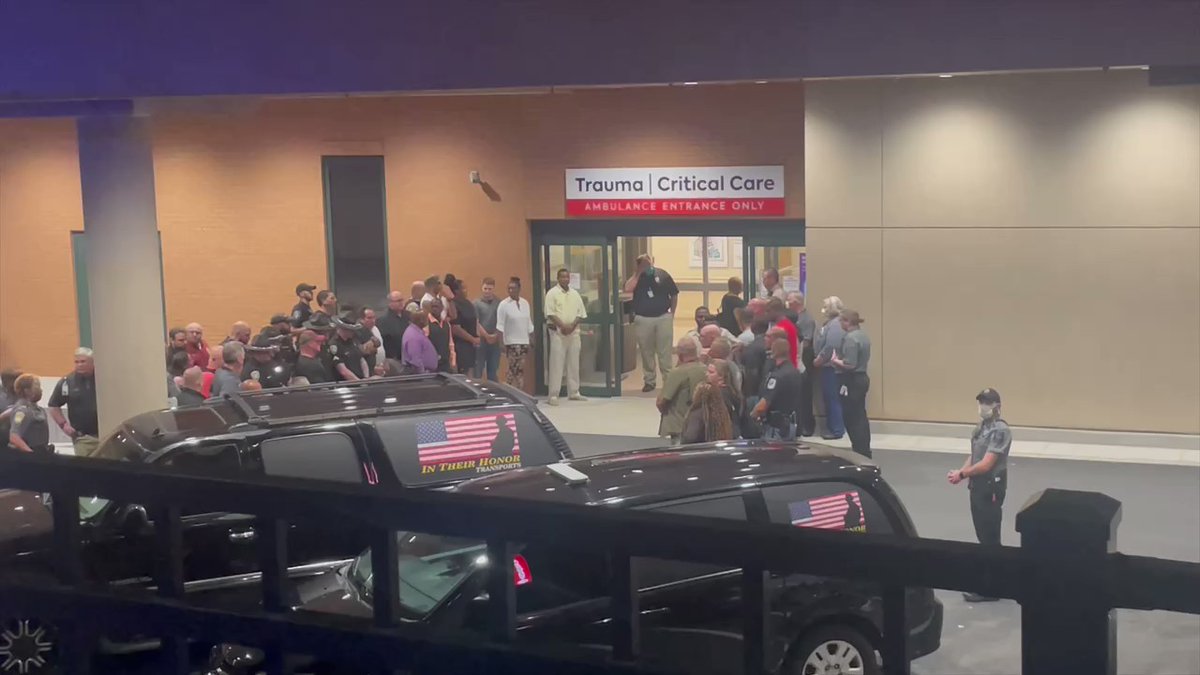 Law enforcement from across the region huddled around the ER at Wellstar Kennestone Hospital.   A show of support as the bodies of 2 deputies will be escorted from here to the Medical Examiner's office.  Those 2 deputies killed while serving a warrant