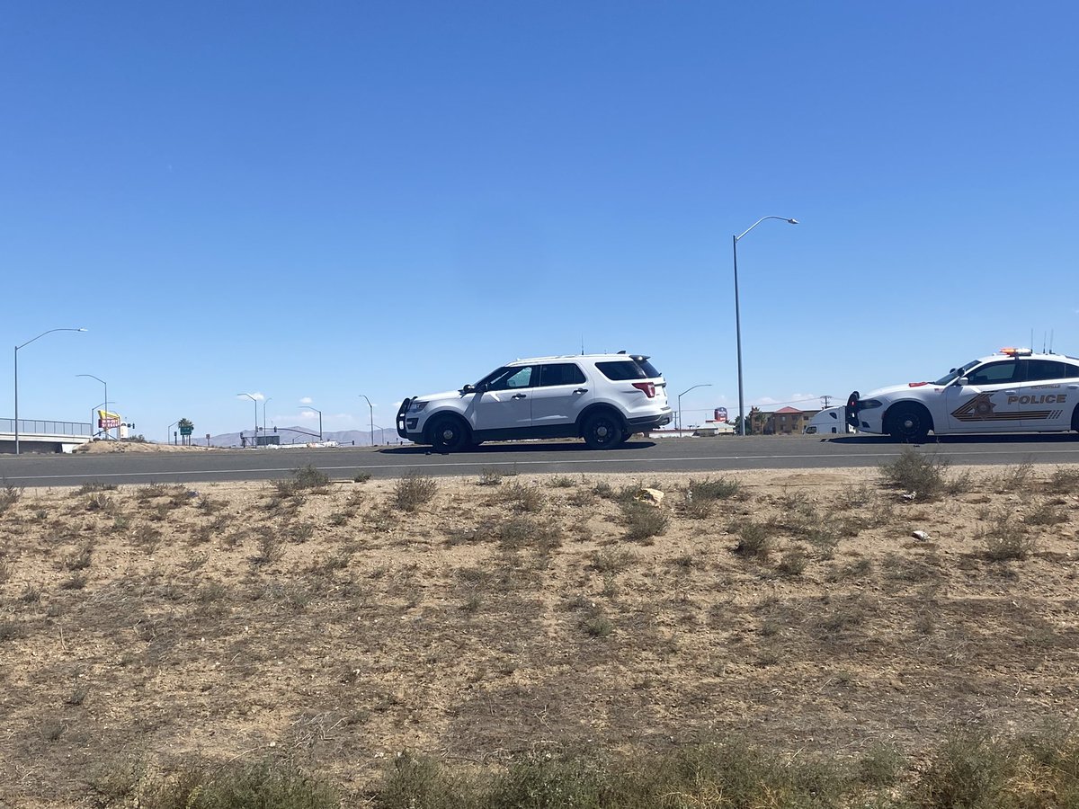 Witnesses tell sheriff's deputies took cover behind this white SUV as they exchanged gunfire with the suspect linked to yesterday's deadly shooting near a Fontana school. This is in Hesperia. Suspect has died, and his 15 year-old daughter is hospitalized, authorities say