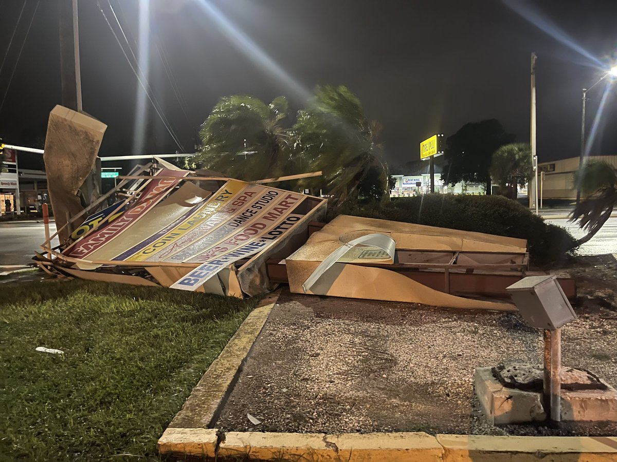 Damage in PinellasCounty. In Seminole this massive shopping plaza sign collapsed over. It looks like the steel is rusted. The wind is whipping. In largo, power is out on East Bay Dr.