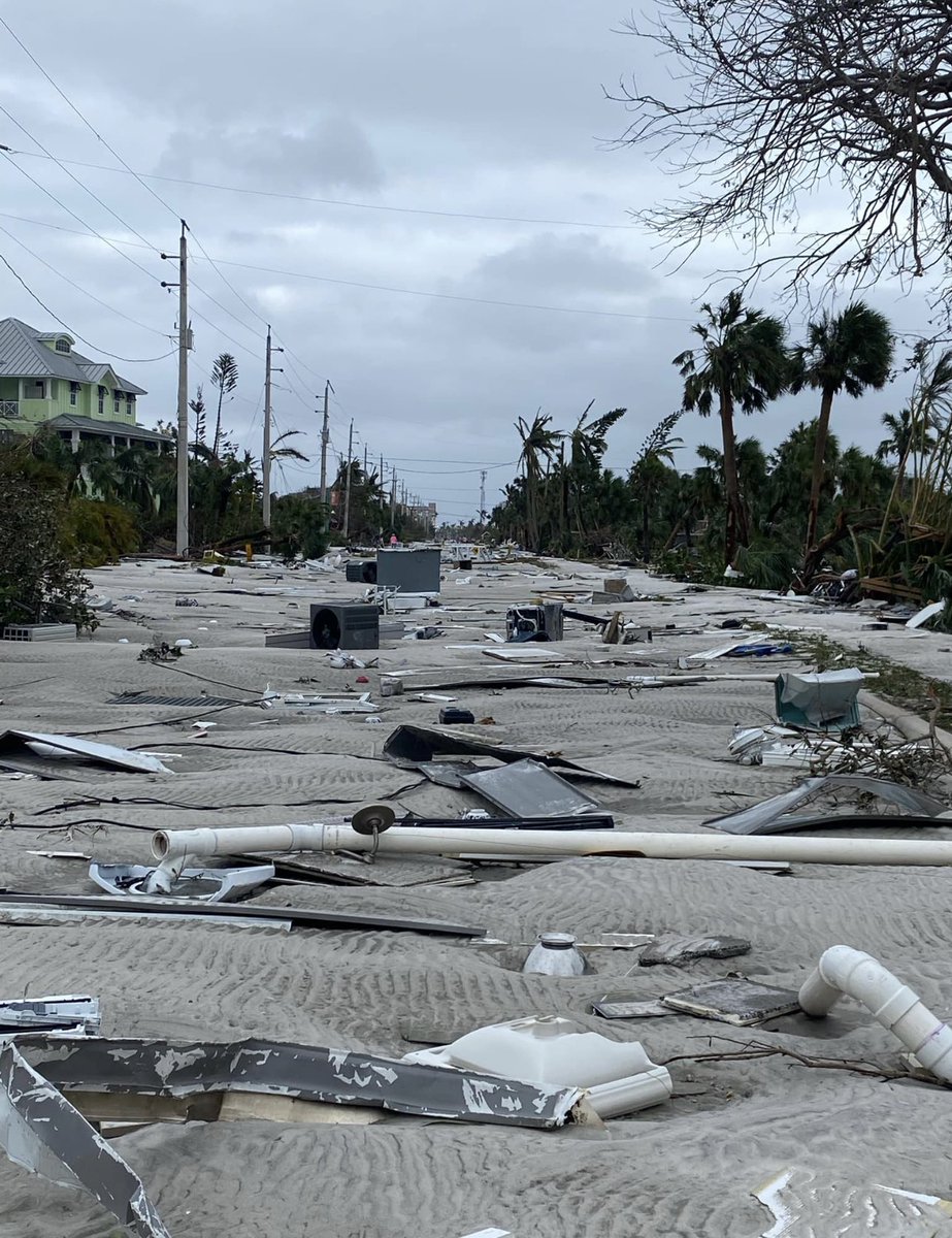 This used to be a street. Now look. A family living on Fort Myers Beach