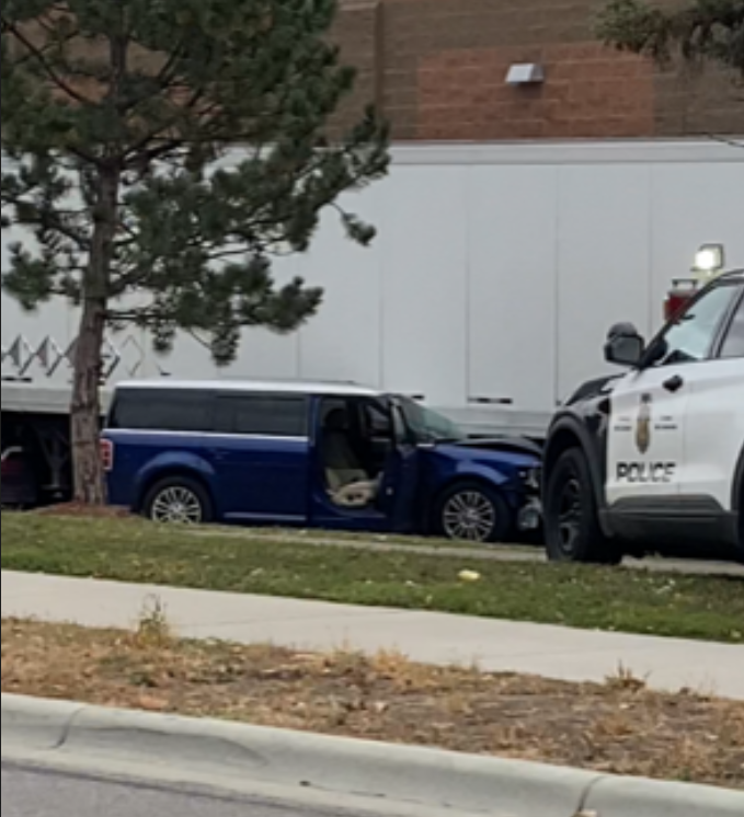 Injury crash behind the Quarry NEMPLS.  blue vehicle pictured ran over trees and a light post on 18th Ave NE, behind Target.  47-year-old male driver, possible seizure, per responders