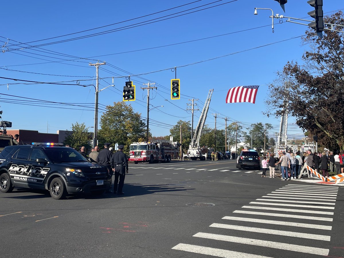Crowd gathering in North Haven to pay their respects to fallen Bristol Sgt. Dustin DeMonte.  A procession with his fellow officers is on its way to the North Haven Funeral home