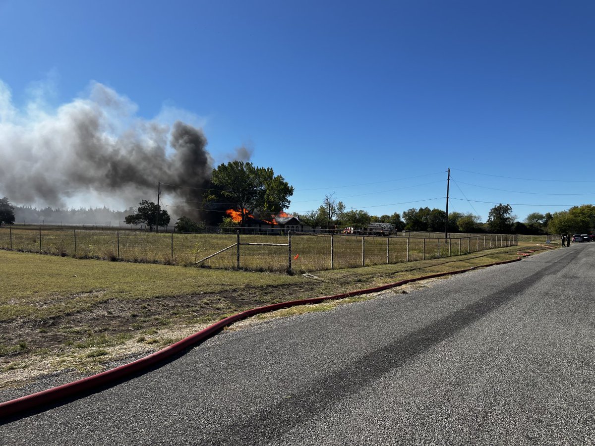 Multiple fire departments are responding to a house fire in the Woodcock Drive area of Robinson