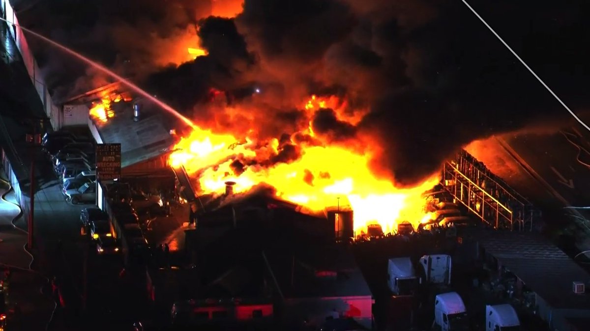 What began as a vegetation fire quickly spread to what is believed to be an auto mechanic shop. LAFD still battling the fire from the ground and air. So far no injuries