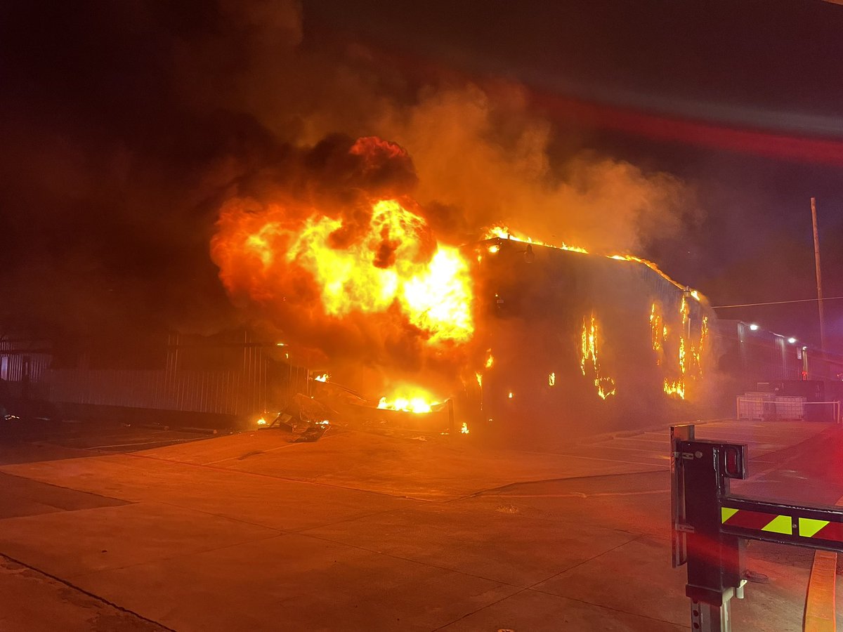The fire department is still here in scene of this warehouse fire. We are right near command where they are making a plan.