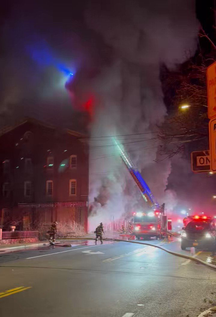 Massive fire underway on Lonsdale Avenue in Lincoln at Knock On Wood Furniture store — a family business in the area for over 25 years. Smoke is billowing out of both sides of the building.