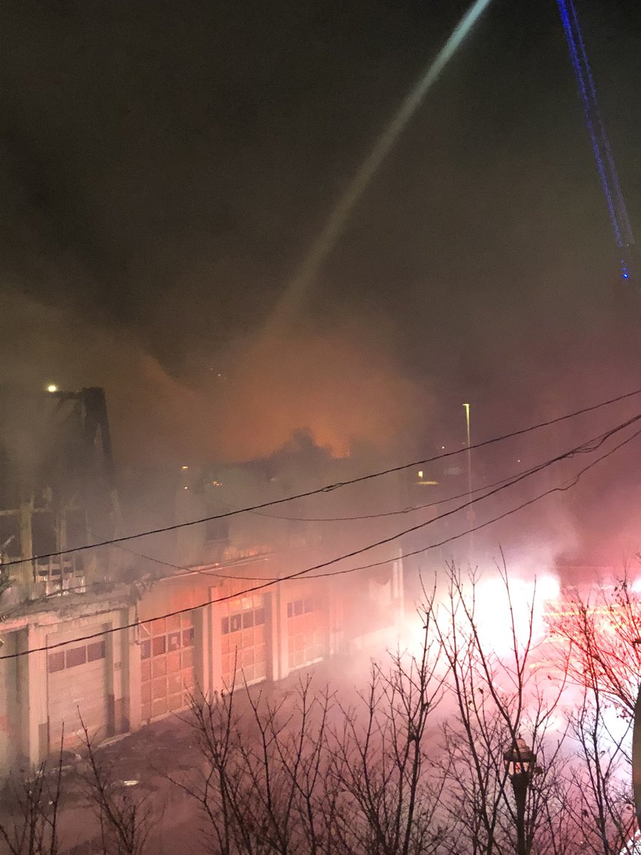 Firefighters continued to put water on a multi alarm fire next to the transit center in downtown Kent. The old commercial building was empty at the time. It is not believed at this time anyone was inside the building when it started