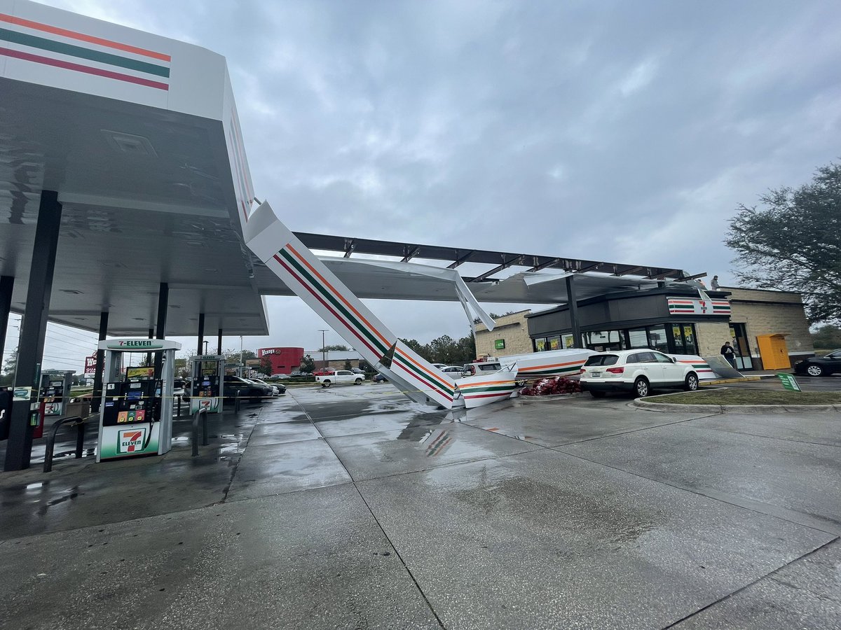 This 7-Eleven was damaged in the storm that hit Spring Hill  You can see part of it came down on the side of that white car