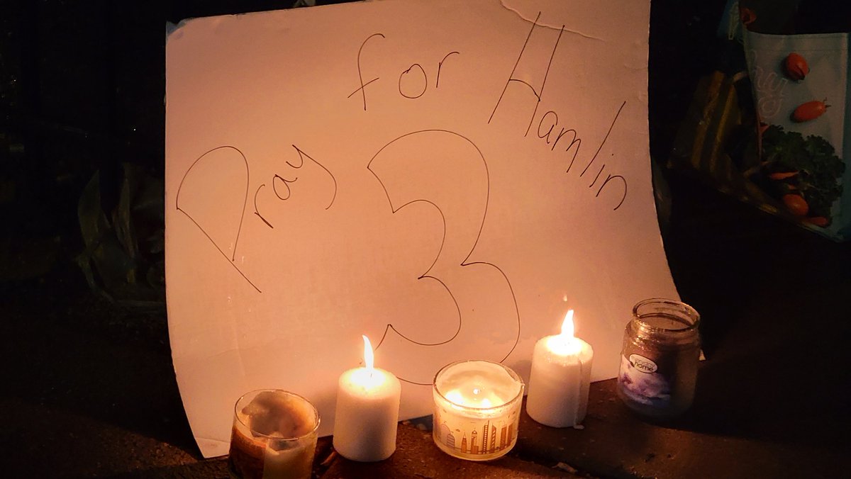 There's a candlelit vigil outside the hospital where Damar Hamlin was taken. It was started by Bills fans.  But Bengals fans kept it going in the rain for more than an hour