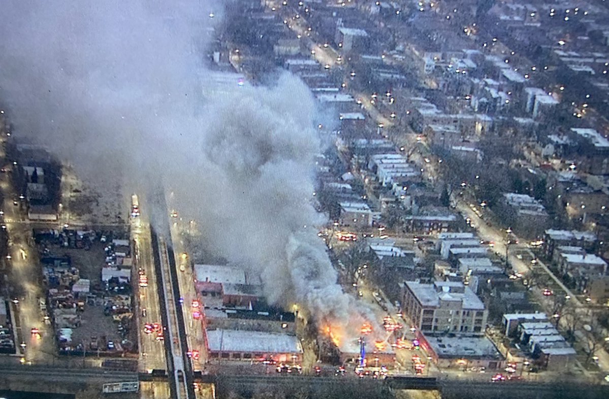 WestGarfieldPark - 2 Alarm fire continues to rage through the entire roof & building at Kenton &amp; Fulton. No injuries reported. Equipment blocks Lake St, Kenton, &amp; Fulton in the area