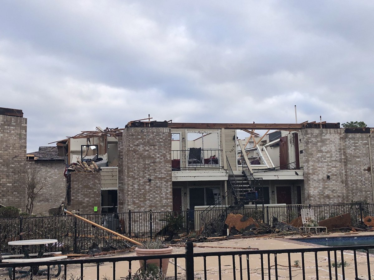 Heavy damage to roofs and second floors at Beamer Place Apt. some loss of second floor walls and tied roof rafters. Many units destroyed. 120-125mph winds