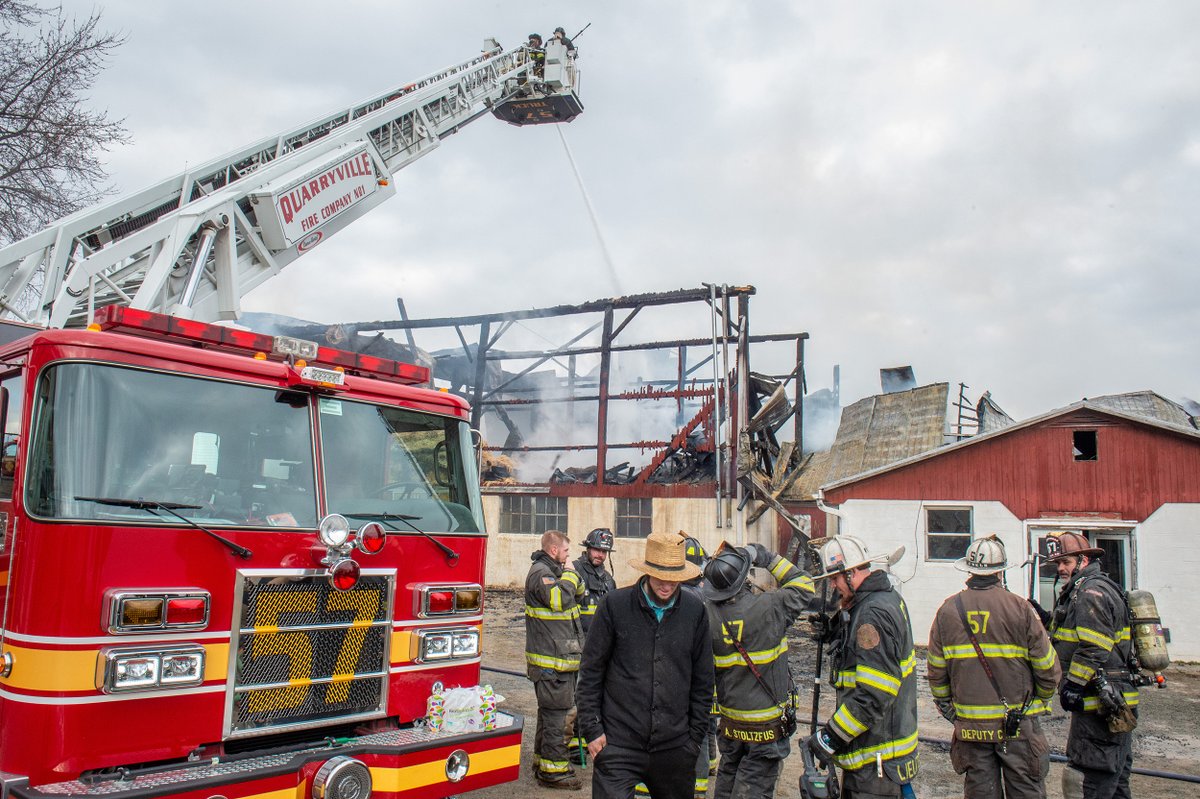 Firefighters still on the scene of the fire that destroyed a dairy barn on White Rock Road in Colerain Township