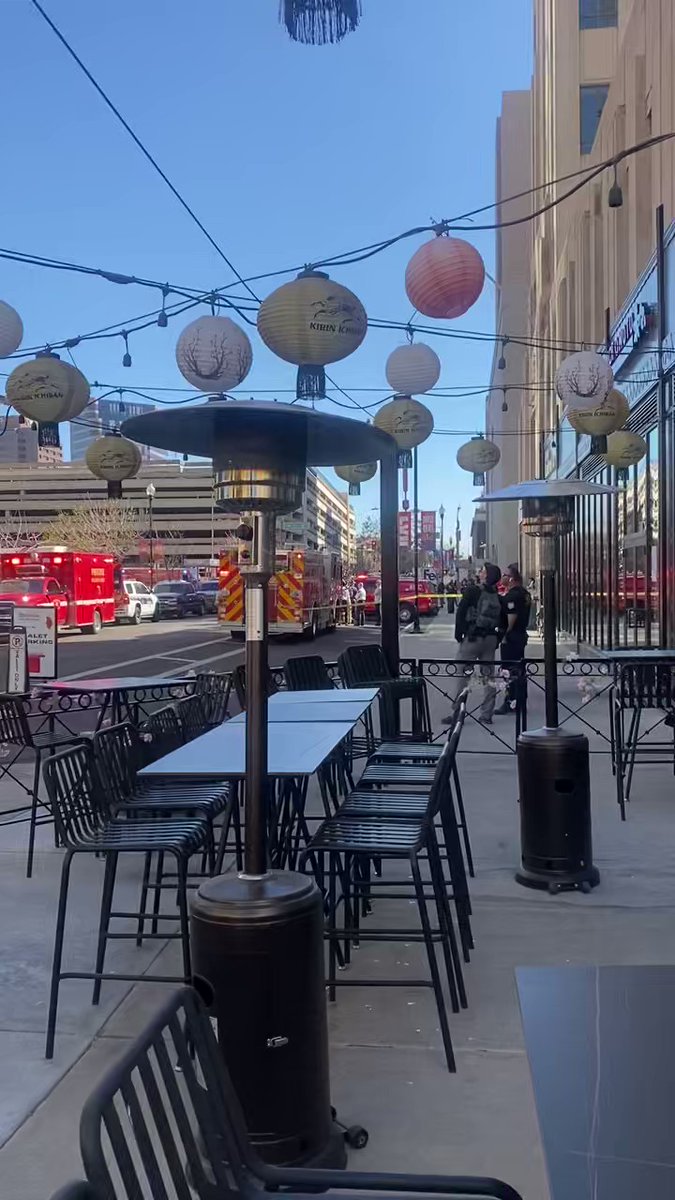 Emergency crews monitoring man climbing Chase Tower in Downtown Phoenix, Arizona; nearby streets closed