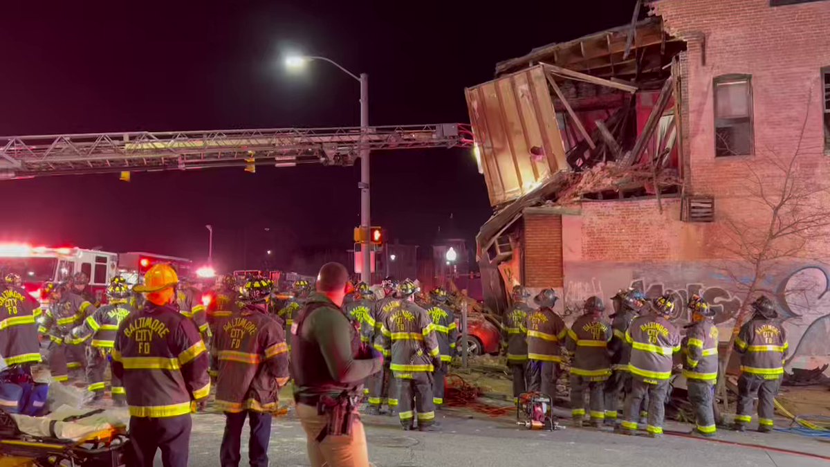 Massive response after a car crashes into a building    Baltimore   Maryland  A massive response is underway after a car crashes into a building causing the building to partially collapse with reports of people trapped inside the building